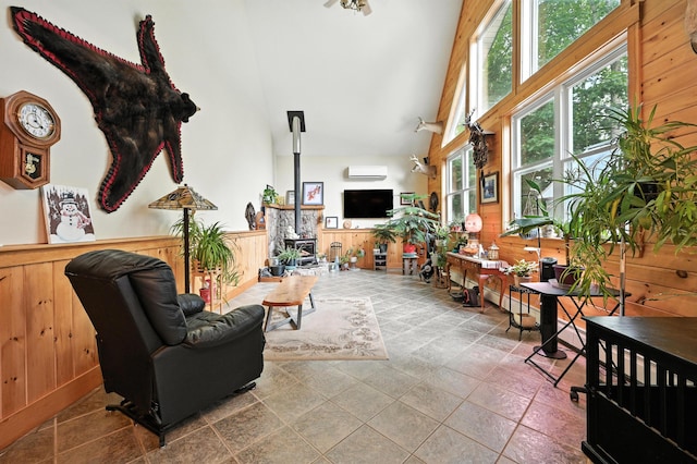 146 Lone Indian Trl, Augusta, ME 04330 - living area with high vaulted ceiling, wooden walls, and wainscoting