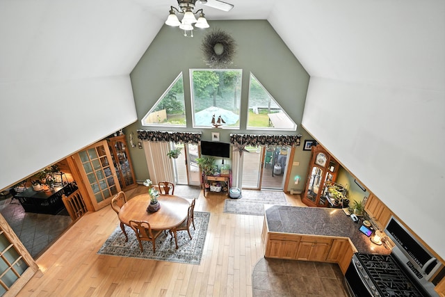 146 Lone Indian Trl, Augusta, ME 04330 - living area with high vaulted ceiling, a ceiling fan, and wood finished floors