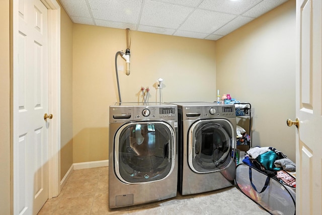 146 Lone Indian Trl, Augusta, ME 04330 - washroom featuring washing machine and clothes dryer and light tile patterned floors