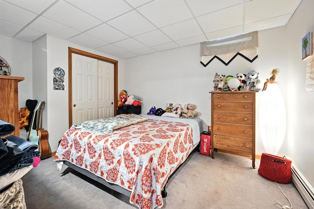 146 Lone Indian Trl, Augusta, ME 04330 - bedroom featuring a baseboard heating unit, carpet flooring, a paneled ceiling, and a closet