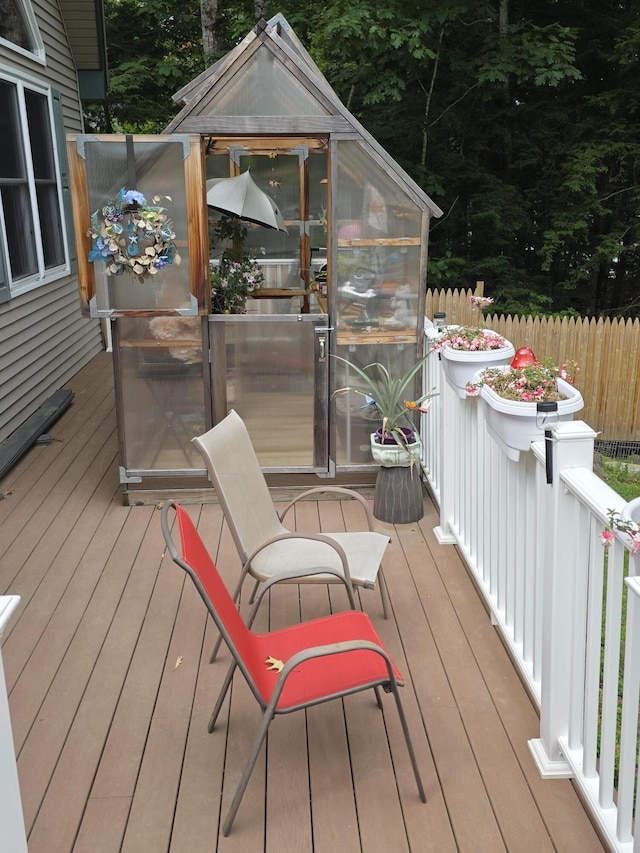 146 Lone Indian Trl, Augusta, ME 04330 - wooden terrace with a greenhouse and view of scattered trees