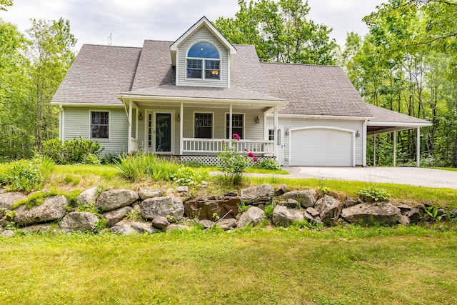 26 Spruce St, Bucksport, ME 04416 - view of front facade featuring covered porch, dirt driveway, a front yard, and a carport