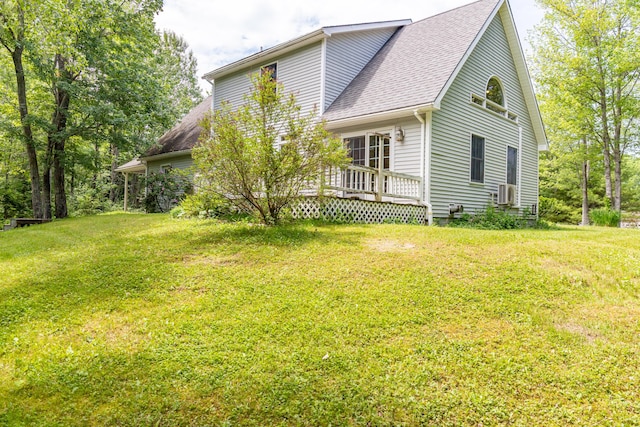 26 Spruce St, Bucksport, ME 04416 - view of side of property with a wooden deck, a yard, and roof with shingles