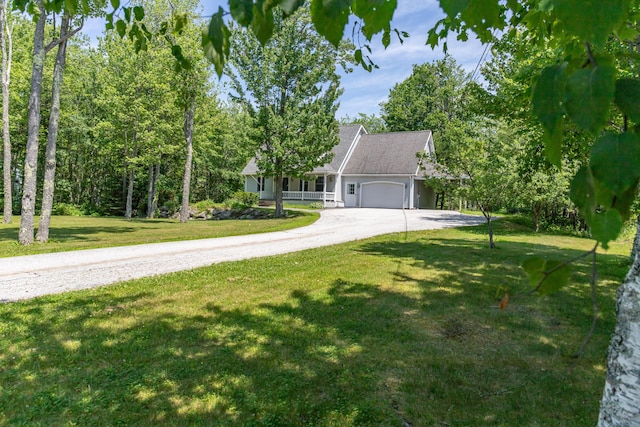26 Spruce St, Bucksport, ME 04416 - view of front of property with an attached garage, driveway, and a front yard