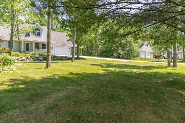 26 Spruce St, Bucksport, ME 04416 - view of grassy yard with an attached garage