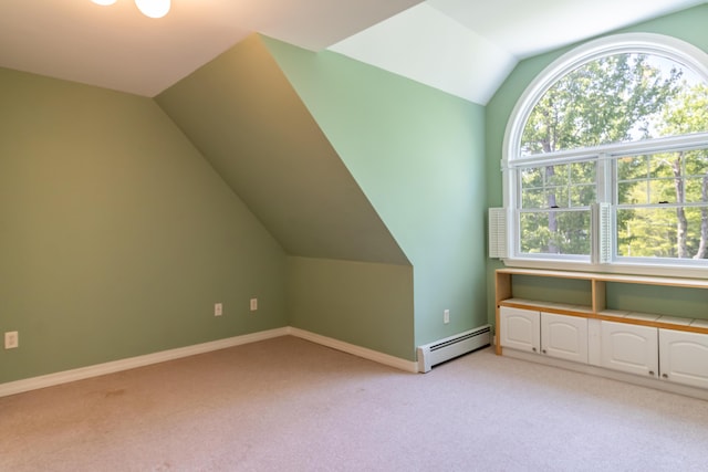 26 Spruce St, Bucksport, ME 04416 - bonus room featuring a baseboard heating unit, lofted ceiling, and light colored carpet