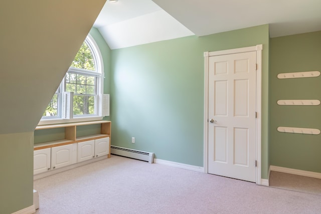 26 Spruce St, Bucksport, ME 04416 - additional living space featuring a baseboard heating unit, light colored carpet, and lofted ceiling