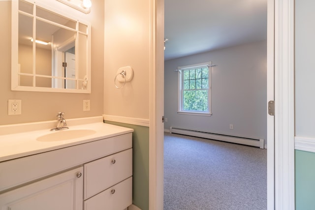 26 Spruce St, Bucksport, ME 04416 - bathroom featuring a baseboard heating unit and vanity