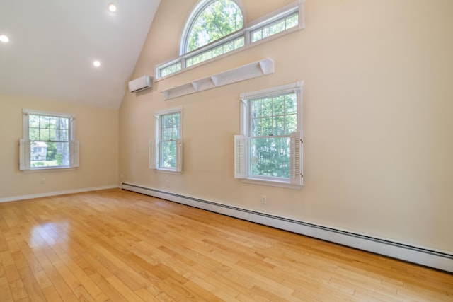 26 Spruce St, Bucksport, ME 04416 - unfurnished room featuring a baseboard radiator, high vaulted ceiling, wood finished floors, healthy amount of natural light, and recessed lighting
