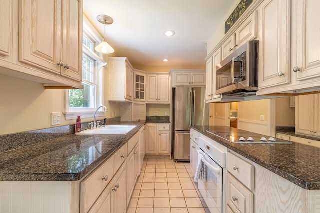 26 Spruce St, Bucksport, ME 04416 - kitchen featuring stainless steel appliances, light tile patterned flooring, hanging light fixtures, glass insert cabinets, and recessed lighting