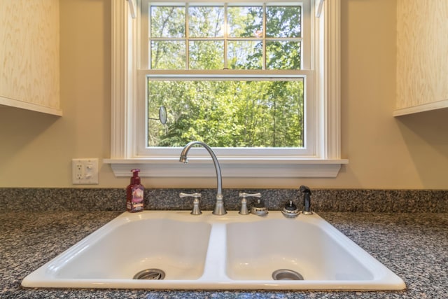 26 Spruce St, Bucksport, ME 04416 - kitchen view of a sink and dark stone countertops