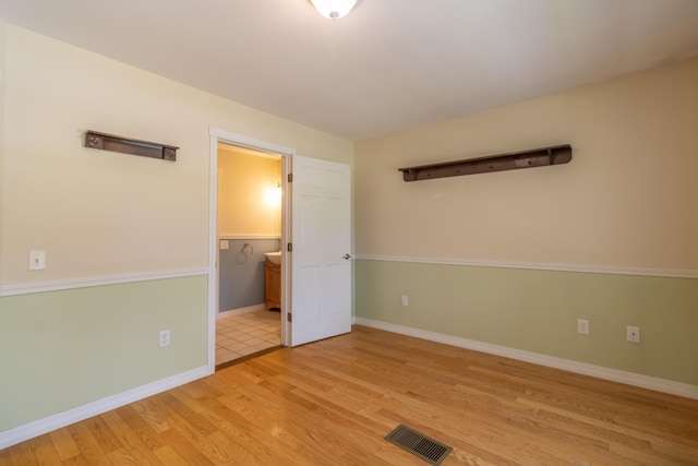 26 Spruce St, Bucksport, ME 04416 - spare room featuring wood finished floors and baseboards