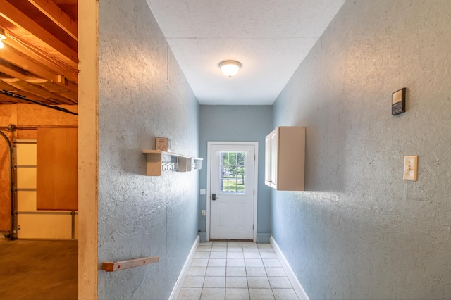 26 Spruce St, Bucksport, ME 04416 - doorway featuring light tile patterned floors and baseboards