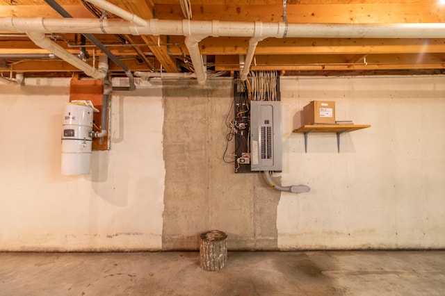 26 Spruce St, Bucksport, ME 04416 - unfinished below grade area featuring electric panel and a central vacuum unit