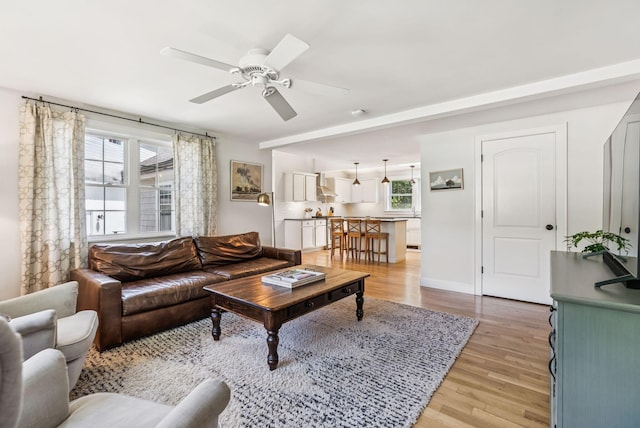 10 Burnell Dr, Yarmouth, ME 04096 - living area featuring light wood finished floors and ceiling fan