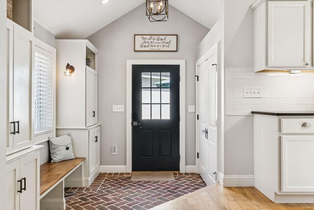 10 Burnell Dr, Yarmouth, ME 04096 - mudroom featuring brick floors and lofted ceiling