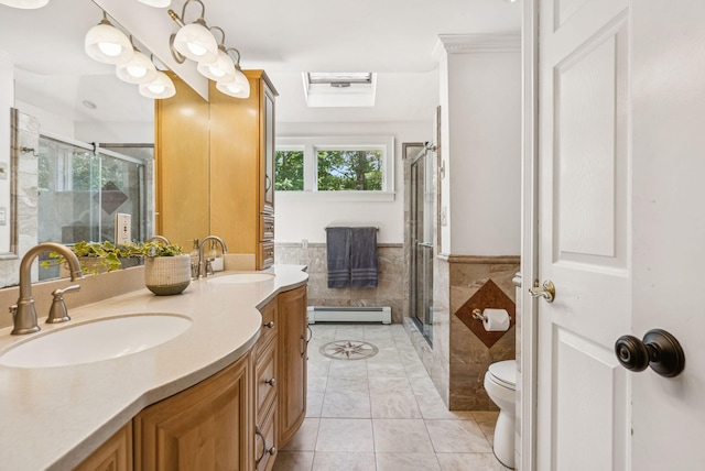 10 Burnell Dr, Yarmouth, ME 04096 - full bath featuring a shower stall, a baseboard heating unit, double vanity, tile patterned floors, and tile walls