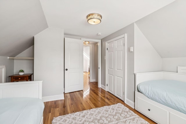 10 Burnell Dr, Yarmouth, ME 04096 - bedroom featuring wood finished floors and vaulted ceiling