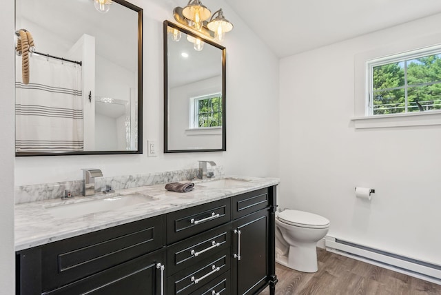 10 Burnell Dr, Yarmouth, ME 04096 - bathroom featuring baseboard heating, double vanity, and wood finished floors