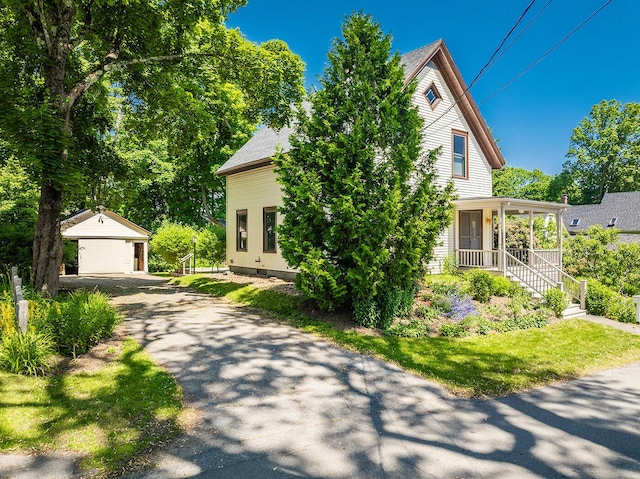 21 Elm St, Belfast, ME 04915 - view of front facade with an outbuilding and a porch