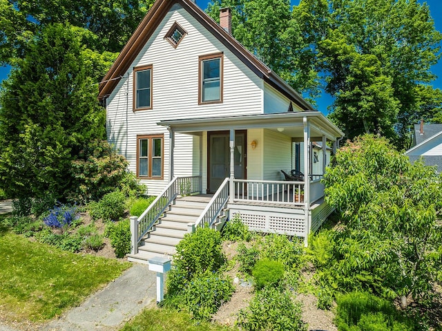 21 Elm St, Belfast, ME 04915 - view of front of property featuring a porch, a chimney, and stairs