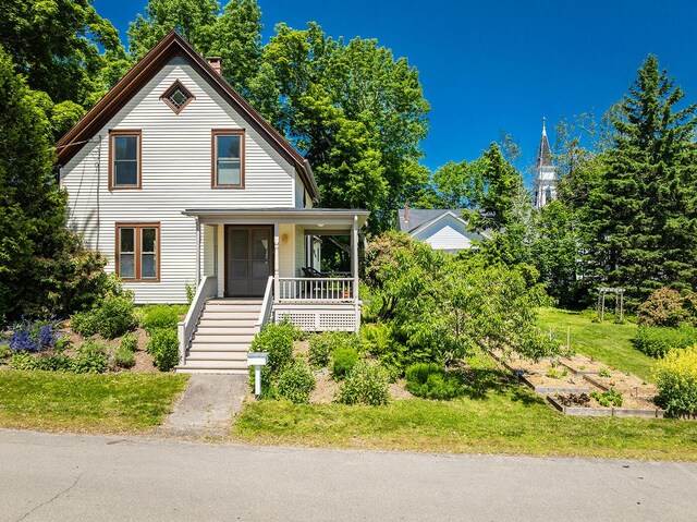 21 Elm St, Belfast, ME 04915 - view of front of property with covered porch and stairs