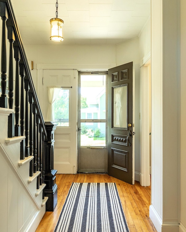 21 Elm St, Belfast, ME 04915 - foyer with light wood-style floors and stairway