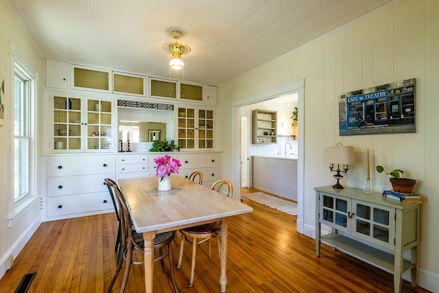 21 Elm St, Belfast, ME 04915 - dining room with ornamental molding and wood-type flooring