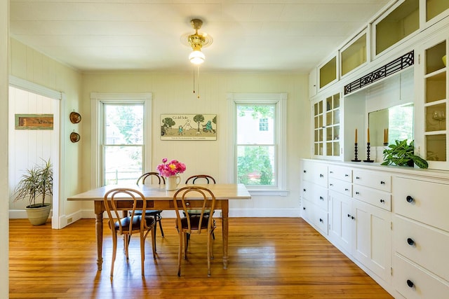 21 Elm St, Belfast, ME 04915 - dining area featuring plenty of natural light, light wood-style flooring, and crown molding