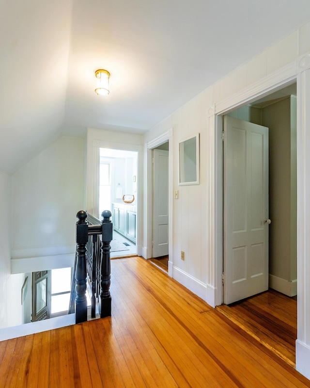 21 Elm St, Belfast, ME 04915 - corridor with an upstairs landing, light wood-style flooring, and lofted ceiling