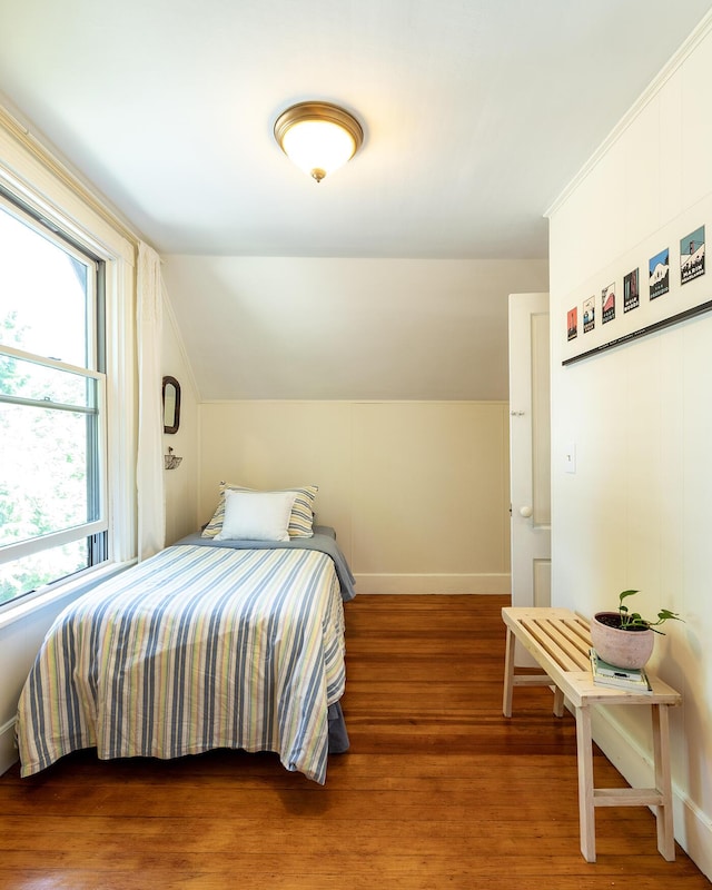 21 Elm St, Belfast, ME 04915 - bedroom featuring vaulted ceiling and wood finished floors