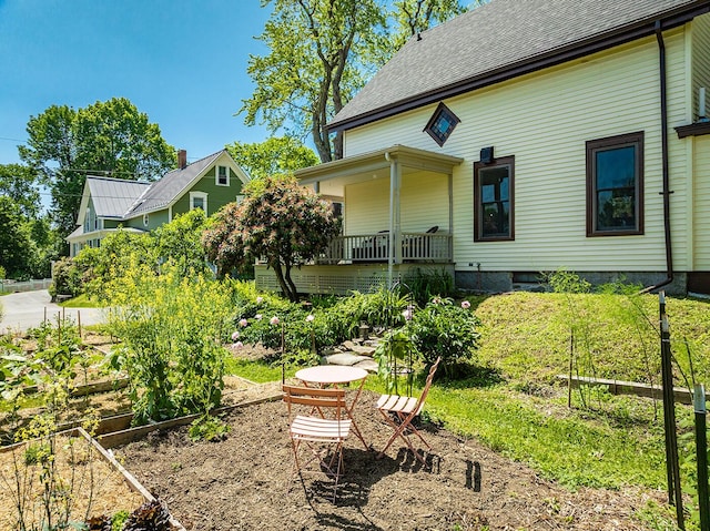 21 Elm St, Belfast, ME 04915 - back of house featuring a vegetable garden