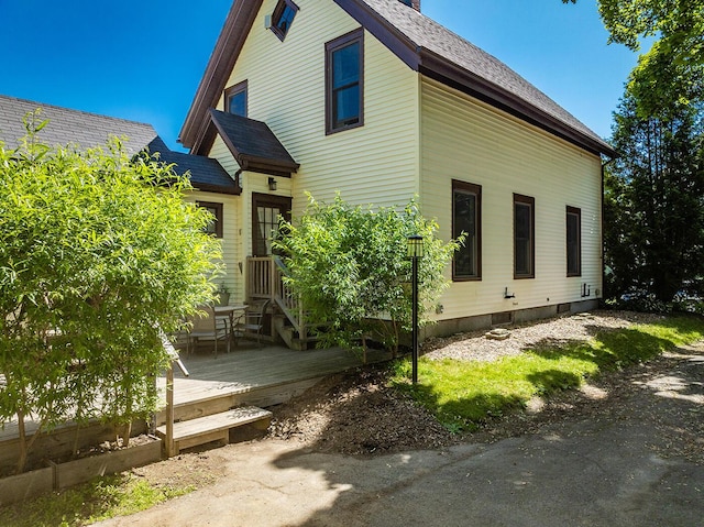 21 Elm St, Belfast, ME 04915 - view of side of property featuring a wooden deck and roof with shingles