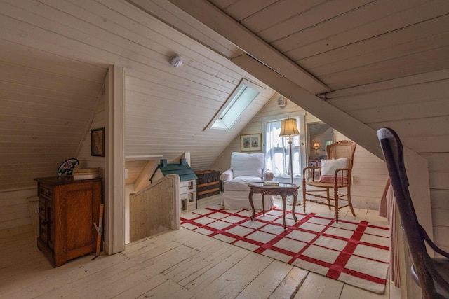 13 Gross Neck Rd, Waldoboro, ME 04572 - sitting room featuring a skylight, light wood-style flooring, vaulted ceiling, wood walls, and wooden ceiling