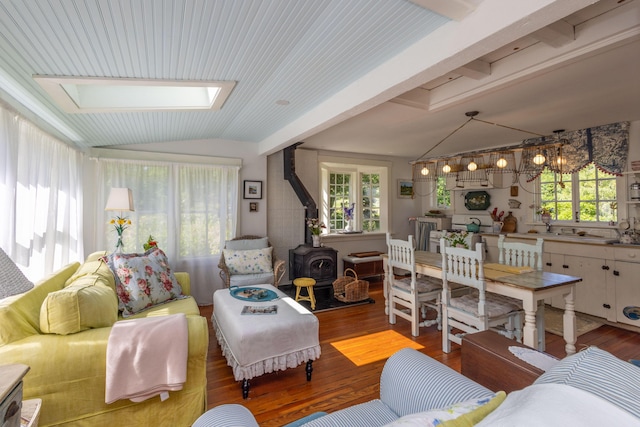 13 Gross Neck Rd, Waldoboro, ME 04572 - living room featuring a wood stove, vaulted ceiling, wood finished floors, and plenty of natural light