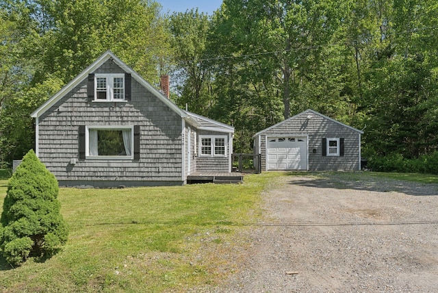 226 Seal Harbor Rd, Saint George, ME 04859 - view of front of house featuring an outdoor structure, a garage, driveway, a chimney, and a front yard