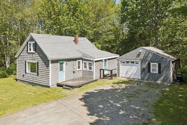 226 Seal Harbor Rd, Saint George, ME 04859 - view of front of property featuring an outdoor structure, gravel driveway, a shingled roof, a detached garage, and a chimney