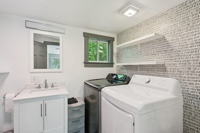 226 Seal Harbor Rd, Saint George, ME 04859 - laundry area featuring independent washer and dryer, cabinet space, and tile walls