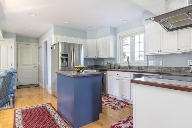 86 Allison Ave, Portland, ME 04103 - kitchen featuring ventilation hood, white cabinets, appliances with stainless steel finishes, and recessed lighting