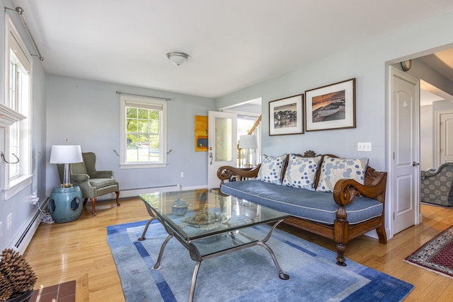 86 Allison Ave, Portland, ME 04103 - living area featuring a baseboard heating unit and light wood-type flooring