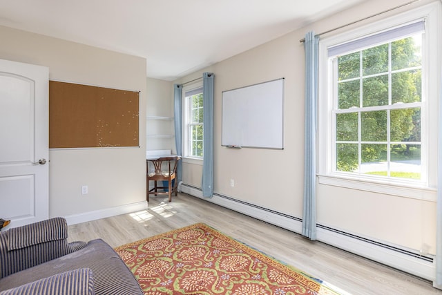 86 Allison Ave, Portland, ME 04103 - living area featuring light wood-style flooring and a baseboard radiator