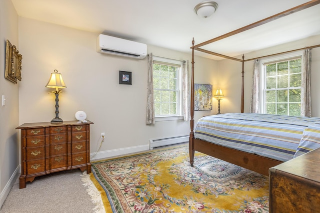 86 Allison Ave, Portland, ME 04103 - bedroom featuring a wall unit AC, a baseboard radiator, and wood finished floors