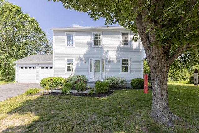 86 Allison Ave, Portland, ME 04103 - colonial home featuring a front lawn, driveway, and a garage