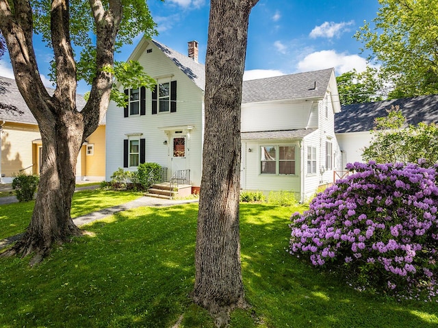 131 Russell Ave, Rockport, ME 04856 - traditional-style house featuring a front lawn, roof with shingles, and a chimney