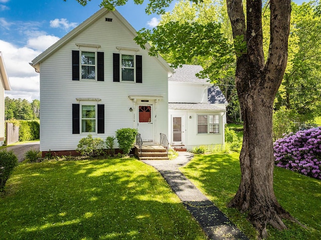 131 Russell Ave, Rockport, ME 04856 - traditional home with a front lawn and a shingled roof
