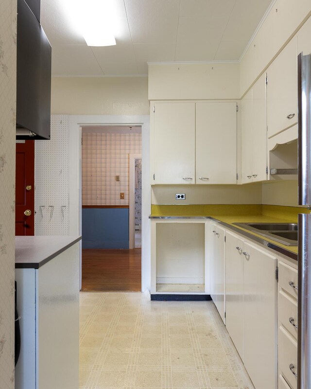 131 Russell Ave, Rockport, ME 04856 - kitchen featuring white cabinets and light wood-style flooring