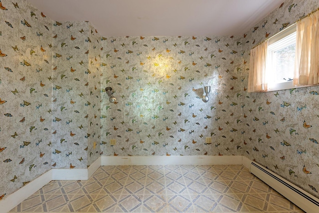 131 Russell Ave, Rockport, ME 04856 - unfurnished room with a baseboard radiator and wallpapered walls