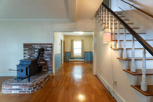 131 Russell Ave, Rockport, ME 04856 - hall with wood finished floors, a baseboard radiator, stairs, and beam ceiling
