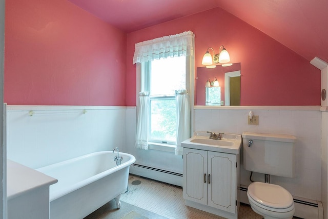 131 Russell Ave, Rockport, ME 04856 - full bathroom with a baseboard heating unit, wainscoting, a freestanding tub, vanity, and tile patterned floors
