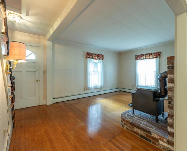131 Russell Ave, Rockport, ME 04856 - unfurnished living room featuring hardwood / wood-style floors, ornamental molding, and a baseboard heating unit